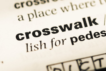Fototapeta premium Close up of old English dictionary page with word crosswalk