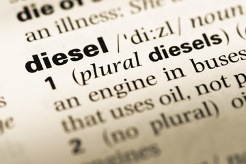 Obraz premium Close up of old English dictionary page with word diesel