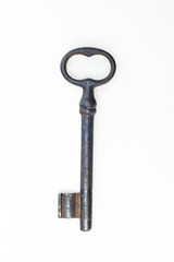 Old iron key on a white background