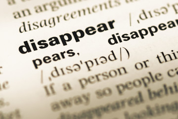 Fototapeta premium Close up of old English dictionary page with word disappear