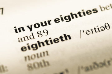 Obraz premium Close up of old English dictionary page with word in your eighti