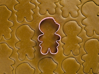 detail view of gingerbread dough with cookie cutter