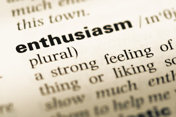 Close up of old English dictionary page with word enthusiasm