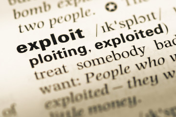 Fototapeta premium Close up of old English dictionary page with word exploit