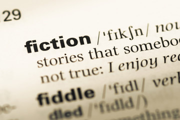 Obraz premium Close up of old English dictionary page with word fiction