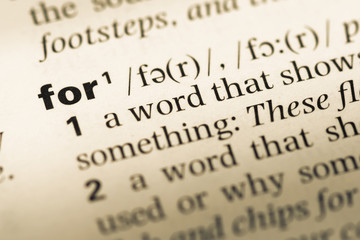 Close up of old English dictionary page with word for