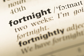 Close up of old English dictionary page with word fortnight