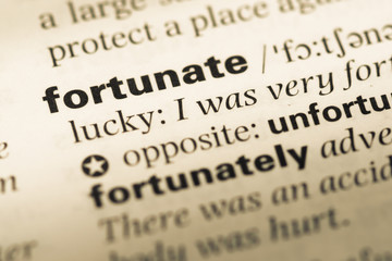 Close up of old English dictionary page with word fortunate