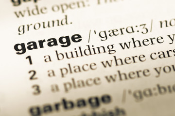 Obraz premium Close up of old English dictionary page with word garage