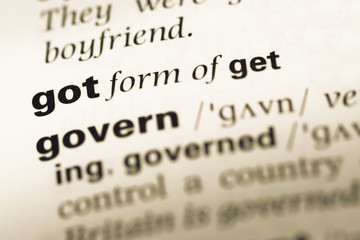 Obraz premium Close up of old English dictionary page with word got