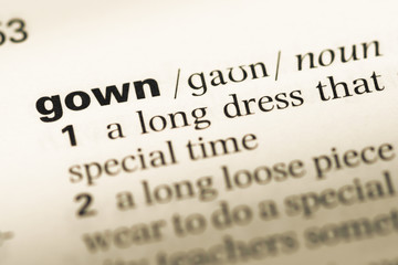 Obraz premium Close up of old English dictionary page with word gown