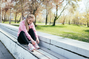 Young woman in the city getting ready for a run.