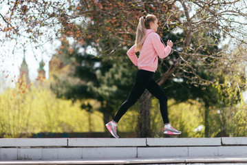 Sporty woman running and training outdoor.