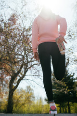 Runner woman warm up