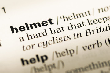 Obraz premium Close up of old English dictionary page with word helmet