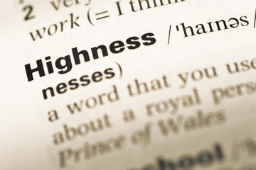 Close up of old English dictionary page with word highness