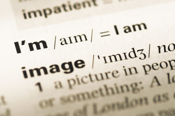 Fototapeta premium Close up of old English dictionary page with word i'm