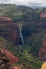 Beautiful Waipoo falls in Waimea Canyon Kauai Hawaii drops 800 feet to the valley floor. This huge...