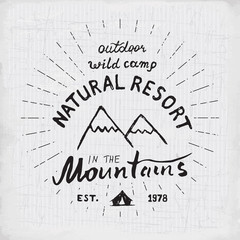 Mountains handdrawn sketch emblem. outdoor camping and hiking activity, Extreme sports, outdoor adventure symbol, vector illustration on grunge background