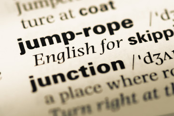 Close up of old English dictionary page with word jump rope