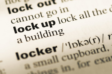 Fototapeta premium Close up of old English dictionary page with word lock up