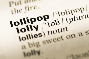 Obraz premium Close up of old English dictionary page with word lollipop