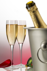 champagne bottle, glasses and cooler bucket