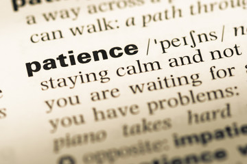 Close up of old English dictionary page with word patience © TungCheung