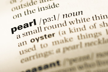 Close up of old English dictionary page with word pearl