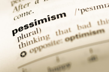 Close up of old English dictionary page with word pessimism