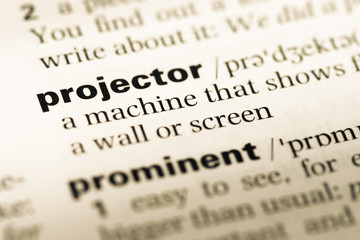 Fototapeta premium Close up of old English dictionary page with word projector