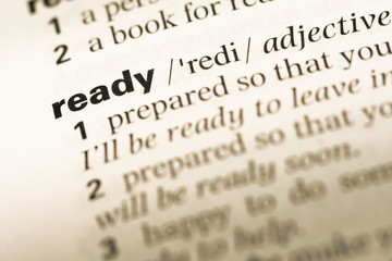 Fototapeta premium Close up of old English dictionary page with word ready