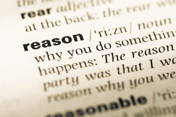 Fototapeta premium Close up of old English dictionary page with word reason
