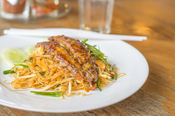 Pad Thai noodle, stir fried rice noodles with crayfish or mantis shrimp, is the popular of Thailand's national main dish.