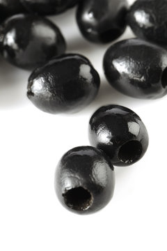 macro image ob black olives © Dan Kosmayer