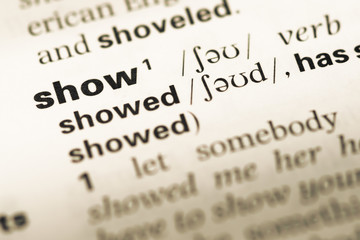 Fototapeta premium Close up of old English dictionary page with word show