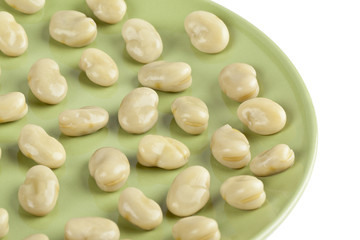 cooked white beans in green plate