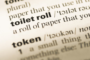 Close up of old English dictionary page with word toilet roll