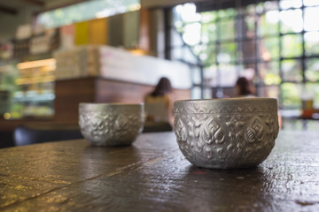 Craving silver cup in thai traditional old style with ice cold water fresh ready to drink on table in dinning room or restaurant/craving silver cup with ice cold water  
