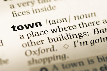 Obraz premium Close up of old English dictionary page with word town