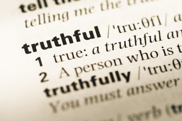 Close up of old English dictionary page with word truthful