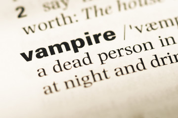 Close up of old English dictionary page with word vampire