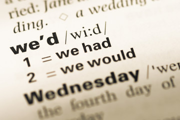 Close up of old English dictionary page with word we'd