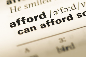 Close up of old English dictionary page with word afford