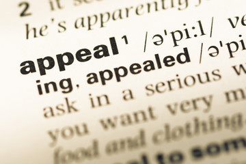 Obraz premium Close up of old English dictionary page with word appeal