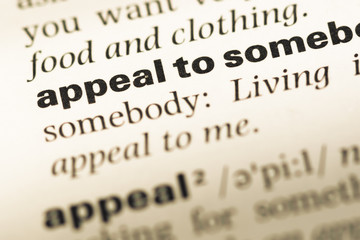 Obraz premium Close up of old English dictionary page with word appeal to