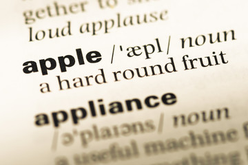 Obraz premium Close up of old English dictionary page with word apple