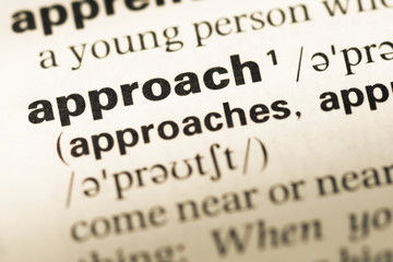 Obraz premium Close up of old English dictionary page with word approach