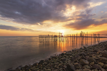 View of "langgai" during beautiful sunset, the traditional fishing medium at Johor, Malaysia.