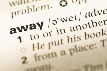 Obraz premium Close up of old English dictionary page with word away